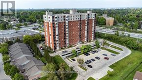 London North (North I) condo for rent - A large apartment building with a parking lot in front.