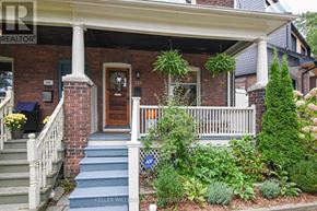 Toronto (The Beaches) apartment for rent - A house with a front porch and a blue staircase.