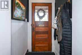 Toronto (The Beaches) apartment for rent - A door with a wreath on it is in a room.