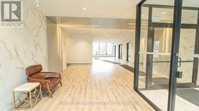 Waterloo condo for rent - A brokerage office with a wooden floor and a marble wall.