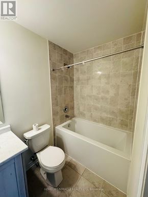 Wellington North (Arthur) apartment for rent - A bathroom with a toilet, a tub, and a shower.