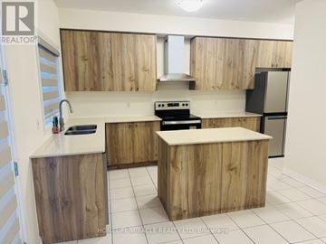 Wellington North (Arthur) apartment for rent - A kitchen with wooden cabinets and a white countertop.
