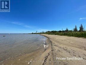 Blue Mountains townhouse for rent - A private sand beach is advertised by Bosley Real Estate.
