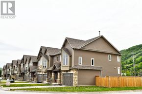 Blue Mountains townhouse for rent - A row of houses with the logo REALTOR at the top left.