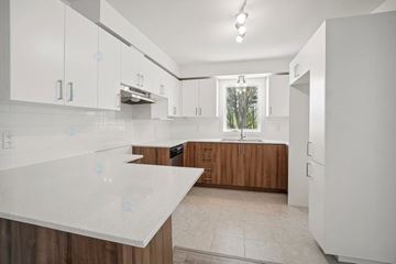 Gatineau (Gatineau) apartment for rent - A kitchen with white cabinets and a countertop.