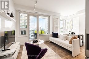 Toronto (Mount Pleasant West) condo for rent - A living room with a purple chair and a white couch.