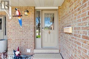 Newmarket (Summerhill Estates) townhouse for rent - A gnome statue is sitting on the front porch of a house.