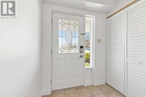 Newmarket (Summerhill Estates) townhouse for rent - A white door with a glass window and a handle is in a room.