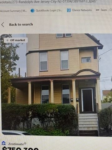 Jersey City apartment for rent - A two-story house with a porch and a front yard.