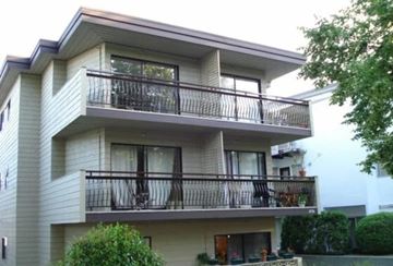 Vancouver apartment for rent - A two-story building with balconies and windows.