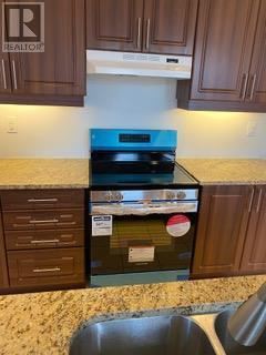 Brampton (Credit Valley) apartment for rent - A blue oven with a stove top sits in a kitchen.