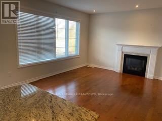 Brampton (Credit Valley) apartment for rent - A living room with a fireplace and a rug on the floor.