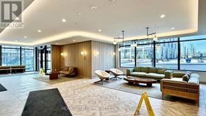 Toronto (Banbury-Don Mills) condo for rent - A large, well-lit living room with a variety of seating options and a view of the outdoors through large windows.