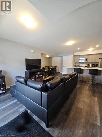 Waterloo townhouse for rent - A black leather couch in a modern living room.