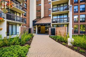 Toronto (Willowdale East) condo for rent - A brick walkway leads to a building entrance.