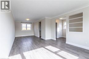 Burlington apartment for rent - A spacious room with a slanted ceiling and hardwood floors.