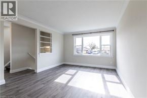 Burlington apartment for rent - A room with a window and a wooden floor.