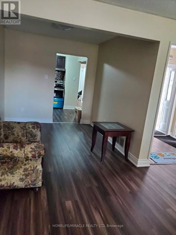 Mississauga (Malton) apartment for rent - A living room with a couch and a table.