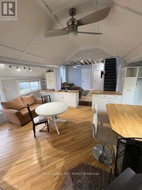 Kincardine apartment for rent - A living room with a couch, chair, and table.