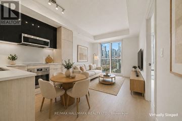 Toronto (Church-Yonge Corridor) condo for rent - A modern kitchen with a dining table set for four.