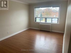 Mississauga (Port Credit) apartment for rent - A room with a window and a radiator on the floor.
