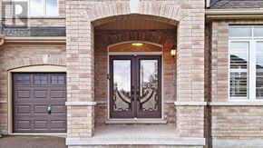 Georgina (Sutton & Jackson's Point) apartment for rent - A house with a brown door and a window with a reflection of a tree.