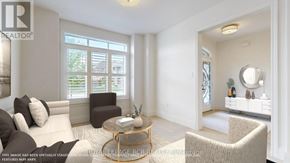Georgina (Sutton & Jackson's Point) apartment for rent - A living room with a white couch, a coffee table, and a large window.