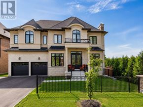 Brampton (Credit Valley) apartment for rent - A large, two-story house with a balcony on the second floor.