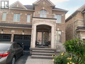 Brampton (Northwest Brampton) apartment for rent - A large house with a car parked in front.