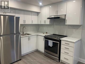 Brampton (Northwest Brampton) apartment for rent - A kitchen with white cabinets and a stainless steel refrigerator.