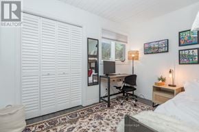 Collingwood townhouse for rent - A bedroom with a bed, desk, and chair.