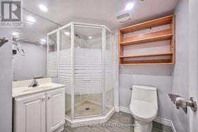 Toronto (Tam O'shanter-Sullivan) apartment for rent - A white bathroom with a walk in shower and a toilet.