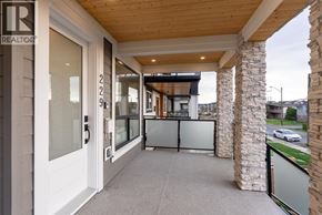 Vancouver apartment for rent - A balcony with a glass door and a stone pillar.