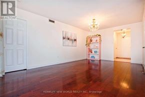 Toronto (Steeles) condo for rent - A room with a wooden floor and a white door.