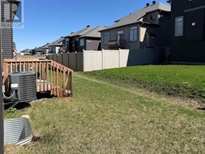 Ottawa townhouse for rent - A house under construction with a green lawn in front.