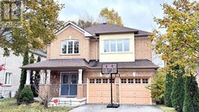 Richmond Hill (Westbrook) apartment for rent - A house with a basketball hoop in the driveway.