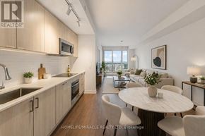 Toronto (South Parkdale) condo for rent - A modern kitchen with a dining table and chairs.