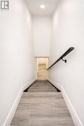 Ottawa multi-family for rent - A long hallway with a staircase in the distance.