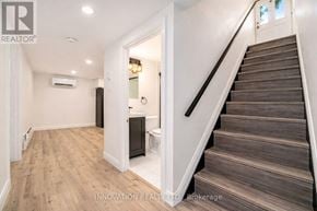 Ottawa multi-family for rent - A staircase with wooden steps and a white wall.