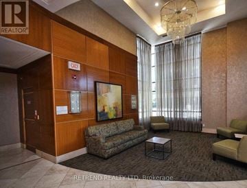 Toronto (Lansing-Westgate) condo for rent - A living room with a sofa, chairs, and a painting on the wall.