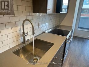 Kitchener condo for rent - A kitchen with a sink and a window.