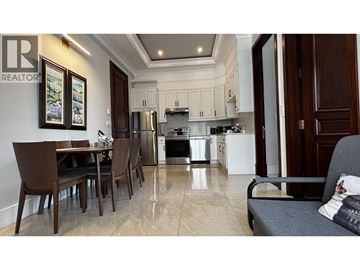 Richmond apartment for rent - A kitchen with a dining table and chairs.