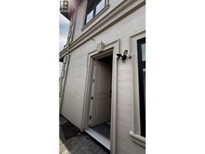 Richmond apartment for rent - A white door is open to a dark room.