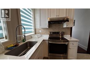 Richmond apartment for rent - A kitchen with a sink, stove, and oven.