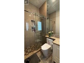 Richmond apartment for rent - A bathroom with a toilet, sink, and shower.
