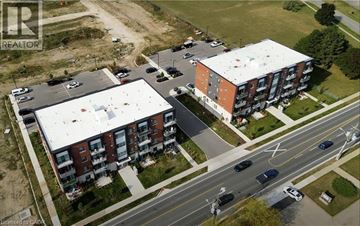 Ayr apartment for rent - Two apartment buildings are shown in an aerial view with cars parked in the parking lot.