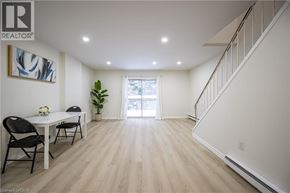 Waterloo townhouse for rent - A well-lit, spacious room with a dining table and chairs.