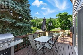 Blue Mountains apartment for rent - A patio with a table and chairs overlooking a mountain.