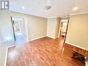 Toronto (Bathurst Manor) apartment for rent - A room with wooden flooring and a slanted ceiling.