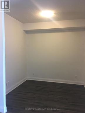 Markham (Unionville) condo for rent - A room with a wooden floor and white walls.